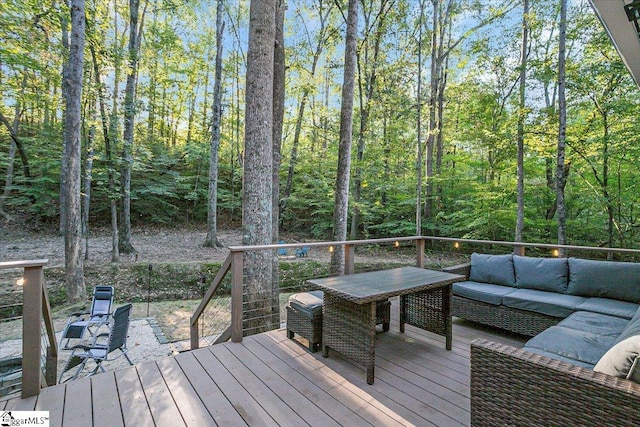 wooden deck with an outdoor hangout area