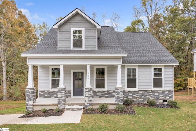 view of front of property with a front lawn and covered porch