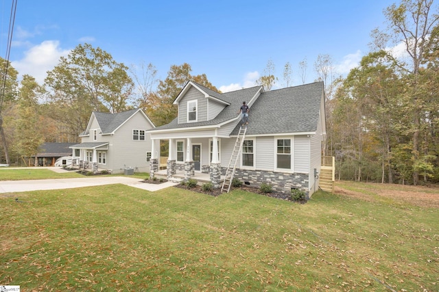 view of front of home featuring a front yard and a porch