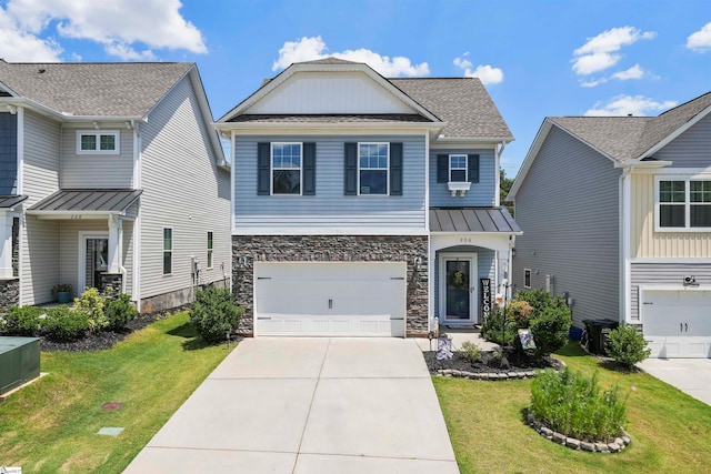 view of front of property with a front yard and a garage