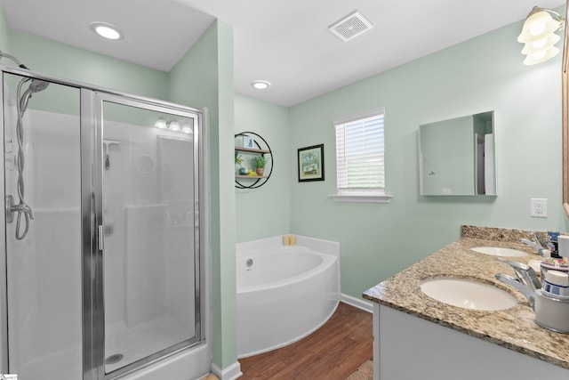 bathroom with vanity, wood-type flooring, and separate shower and tub