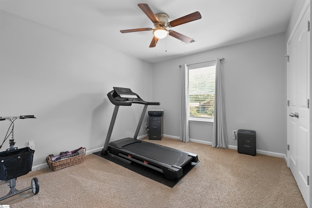 exercise area featuring carpet floors and ceiling fan