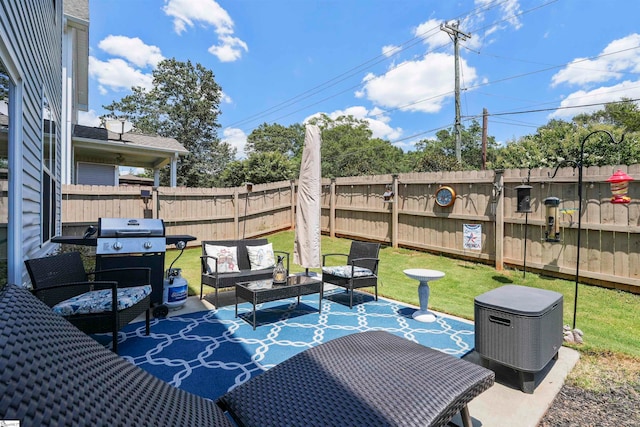 view of patio with a grill and outdoor lounge area