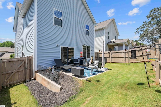 back of house with a patio, a lawn, and outdoor lounge area