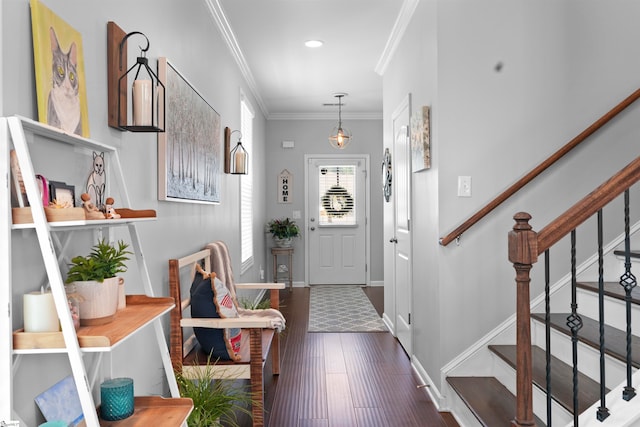 foyer featuring crown molding and dark hardwood / wood-style floors