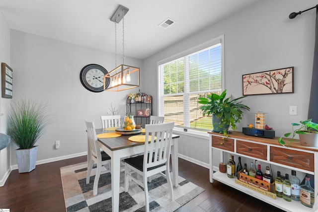 dining area featuring dark hardwood / wood-style flooring