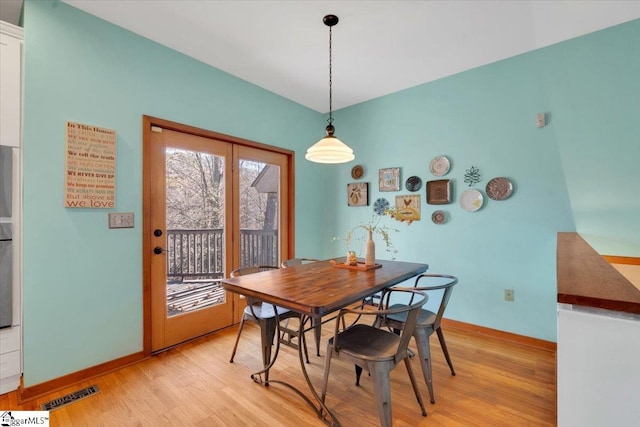 dining area with light hardwood / wood-style flooring