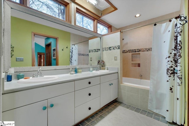 bathroom featuring tile patterned flooring, vanity, plenty of natural light, and shower / bath combination with curtain