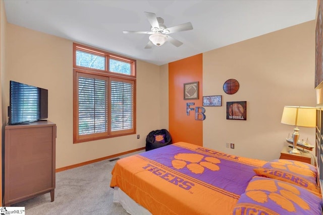 bedroom with light colored carpet and ceiling fan