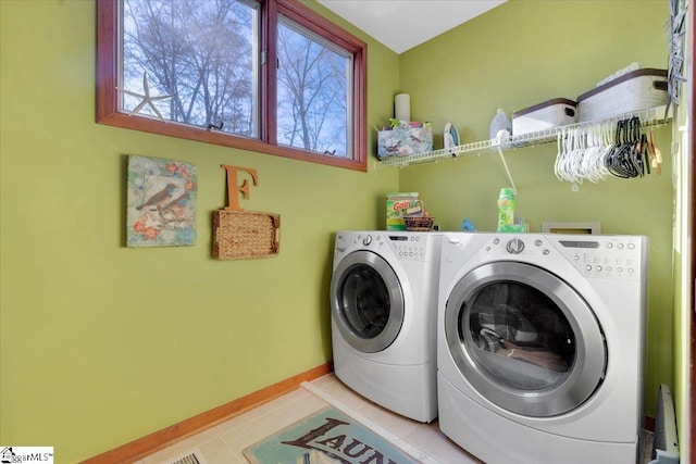 laundry area featuring light tile patterned flooring and independent washer and dryer