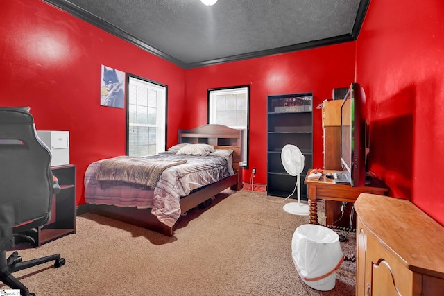 bedroom with a textured ceiling, carpet flooring, and ornamental molding