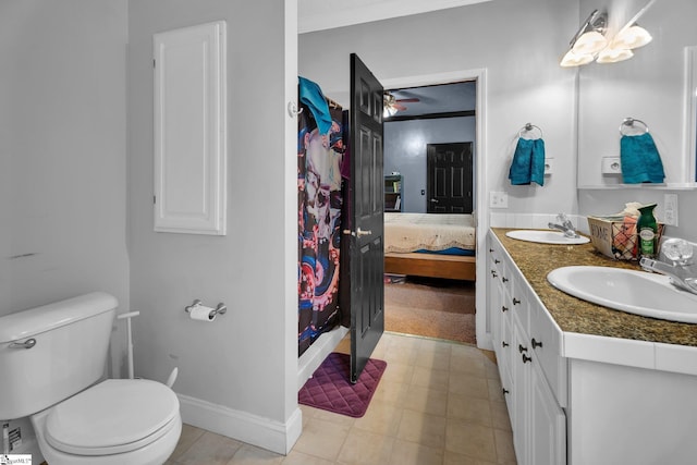 bathroom featuring crown molding, vanity, and toilet