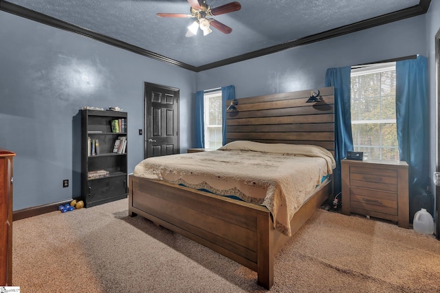 carpeted bedroom featuring a textured ceiling, ceiling fan, and crown molding