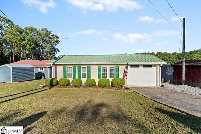 ranch-style home with a front lawn and a garage