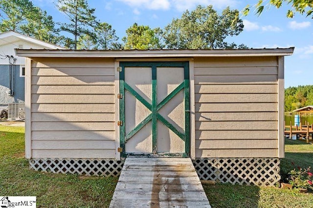 view of outdoor structure featuring central AC unit