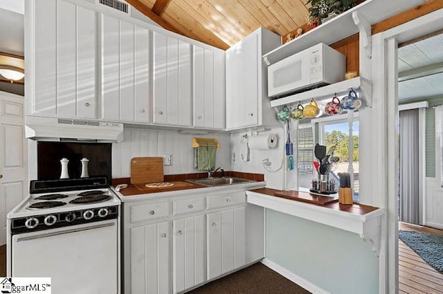 kitchen featuring white cabinets, sink, vaulted ceiling, and exhaust hood