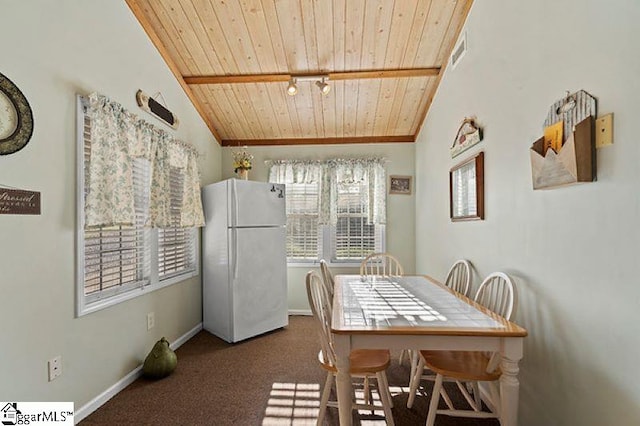 dining area featuring vaulted ceiling, wooden ceiling, and carpet floors