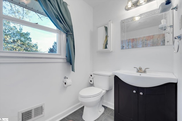 bathroom featuring toilet, a shower with curtain, and vanity