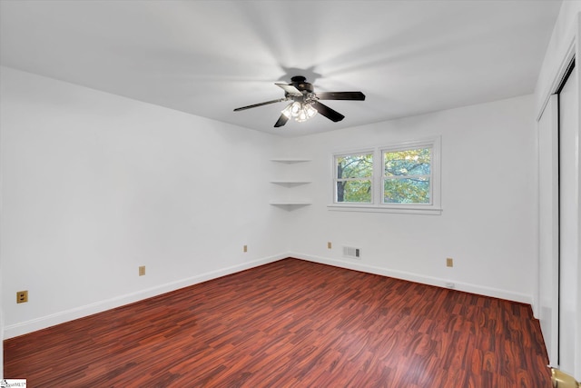 unfurnished bedroom featuring dark hardwood / wood-style floors and ceiling fan