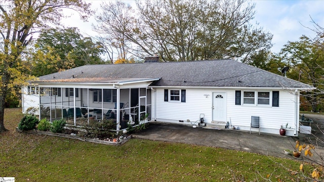 back of house featuring a patio, a sunroom, and a yard