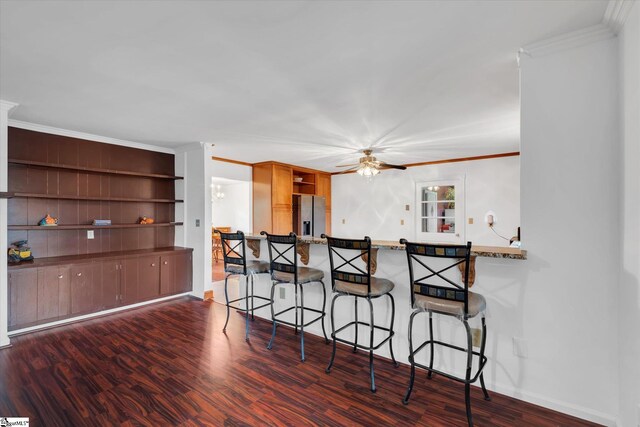 kitchen with stainless steel fridge with ice dispenser, dark hardwood / wood-style floors, kitchen peninsula, and crown molding