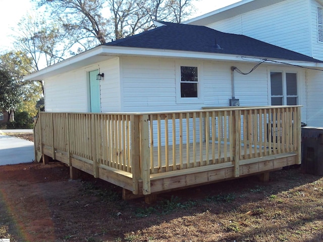 back of property with a wooden deck