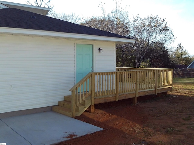 entrance to property with a wooden deck