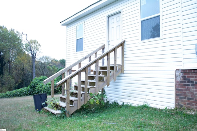 entrance to property with a yard