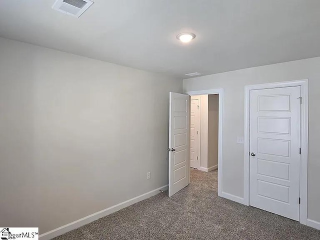 unfurnished bedroom with carpet