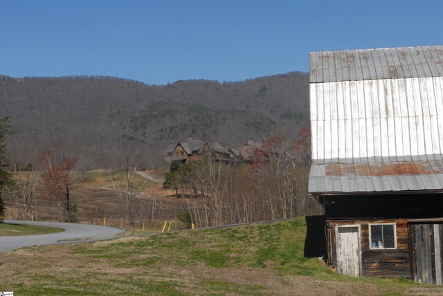 view of side of home with a mountain view