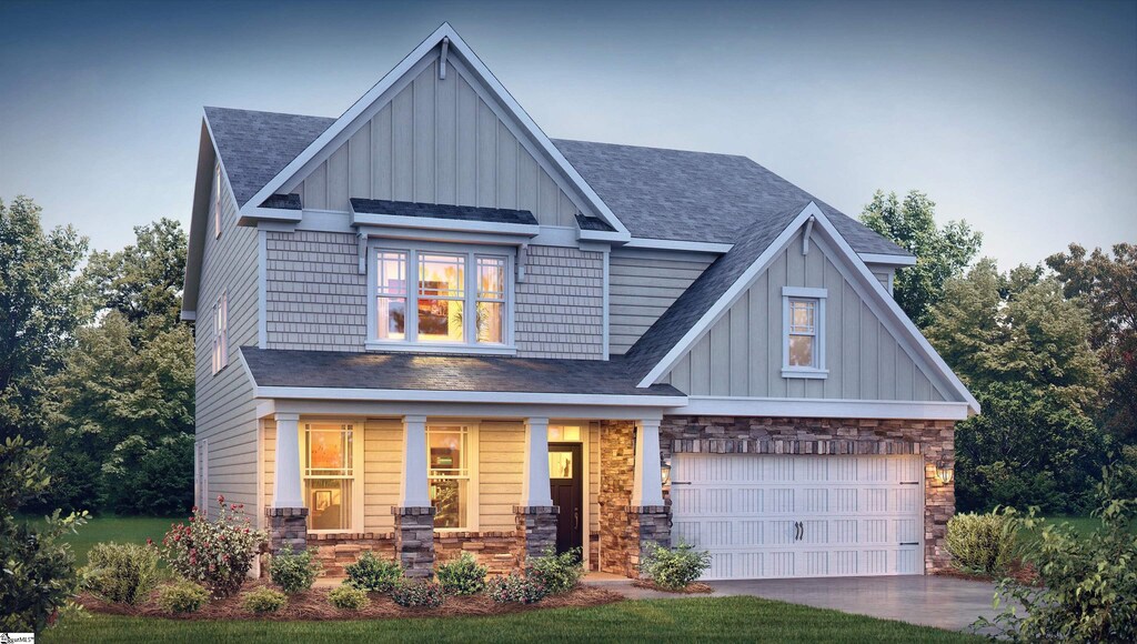 craftsman-style home featuring a garage and covered porch