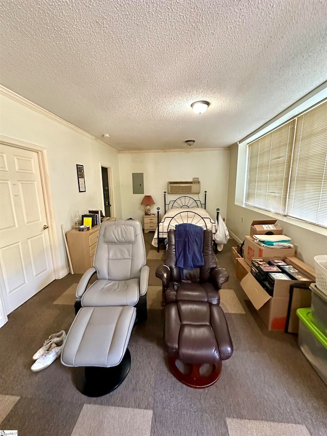 bedroom with a textured ceiling, crown molding, and carpet