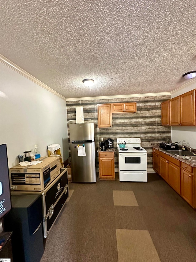 kitchen featuring ornamental molding, a textured ceiling, stainless steel refrigerator, white electric stove, and wooden walls