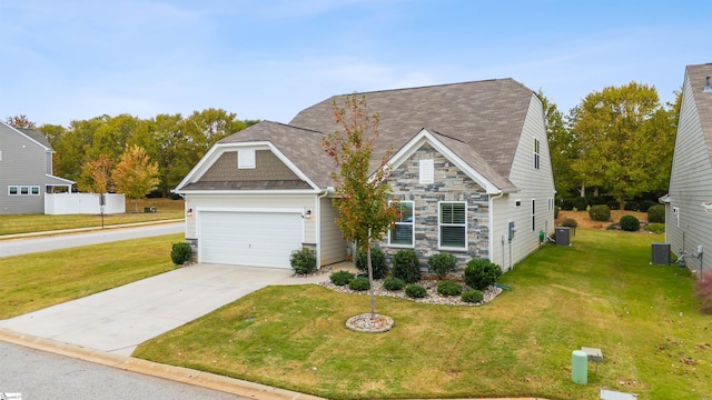 craftsman inspired home with a garage, central AC, and a front lawn