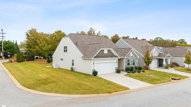 view of front of house featuring central air condition unit, a front yard, and a garage