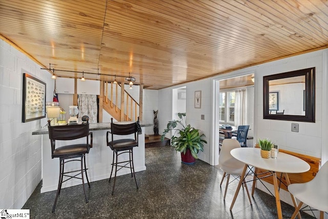 dining area with wooden ceiling