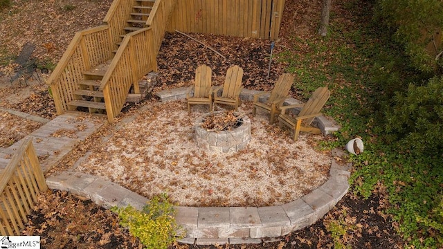 view of yard with a fire pit