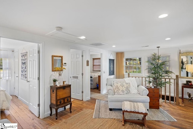 living room with light hardwood / wood-style flooring