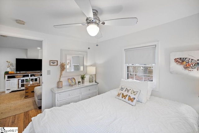 bedroom featuring hardwood / wood-style flooring and ceiling fan