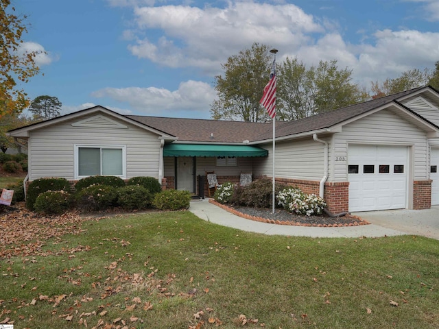 ranch-style house featuring a garage and a front yard