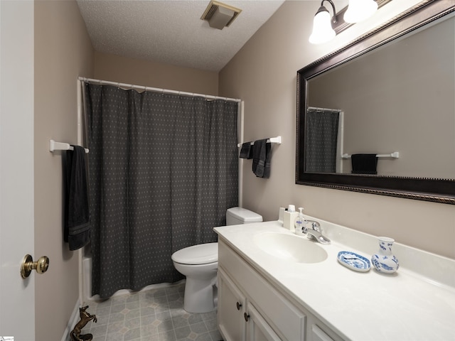 bathroom with walk in shower, vanity, a textured ceiling, and toilet