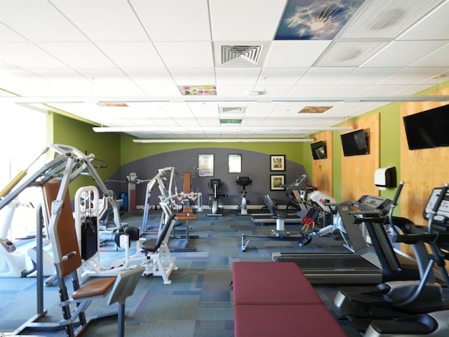 workout area featuring a paneled ceiling