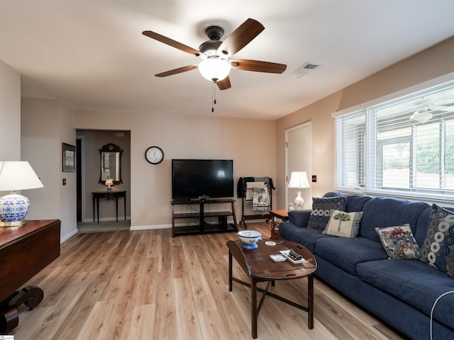 living room with ceiling fan and light hardwood / wood-style floors