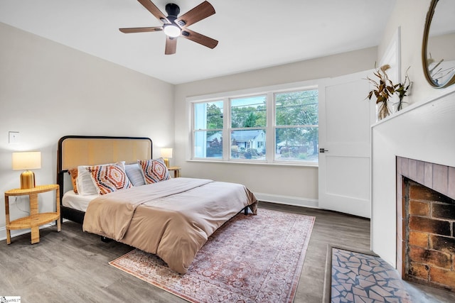 bedroom with wood-type flooring and ceiling fan