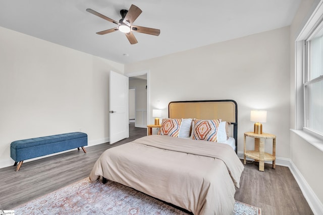 bedroom with hardwood / wood-style floors and ceiling fan