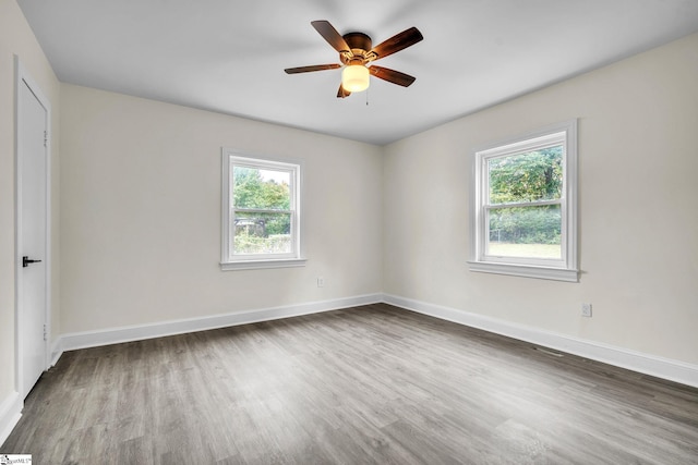 empty room featuring hardwood / wood-style flooring and ceiling fan