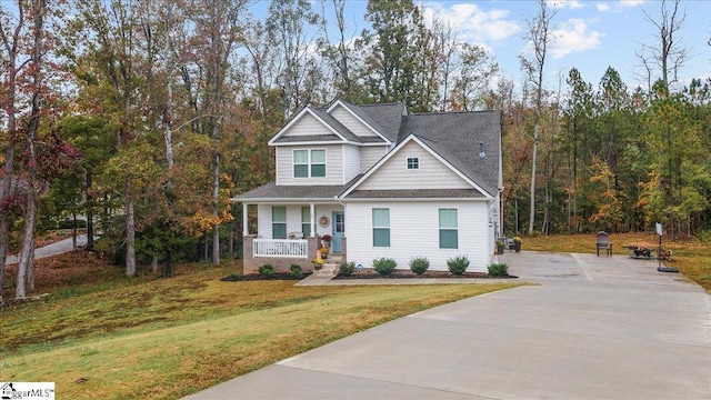 craftsman-style home with covered porch and a front yard