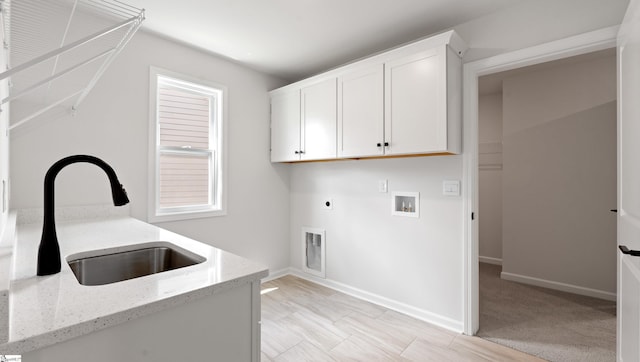 washroom with cabinet space, hookup for a washing machine, electric dryer hookup, and baseboards