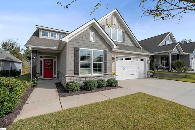 craftsman-style home with a front lawn and a garage