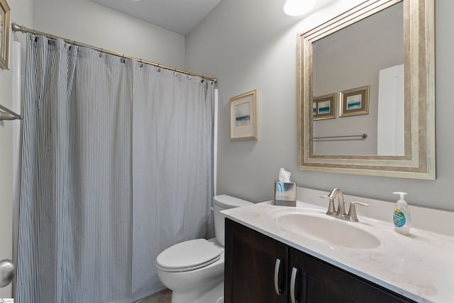 bathroom with toilet and vanity